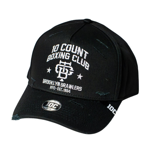 A black distressed baseball cap featuring white embroidered text that reads '10 COUNT BOXING CLUB' and 'BROOKLYN BRAWLERS' with a boxing graphic on the front, and a '10C' logo on the brim.